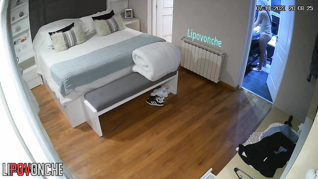 Long-haired girl walking on the flat with thinks about sex