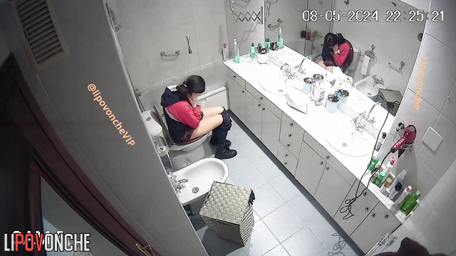 Brunette peeing in the bathroom and thinking about a quarrel with her boy