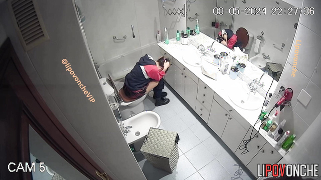 Brunette peeing in the bathroom and thinking about a quarrel with her boy