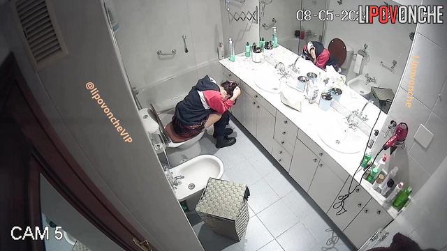 Brunette peeing in the bathroom and thinking about a quarrel with her boy