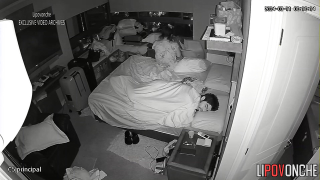 Brunette masturbating on the bed with sleeping boyfriend