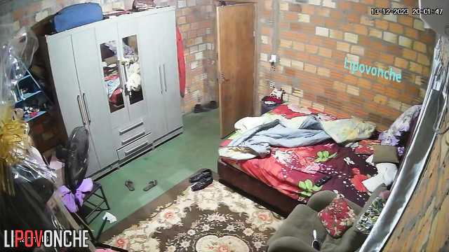Asian mom is combing her relative's hair - bedroom video