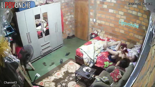 Asian mom is combing her relative's hair - bedroom video