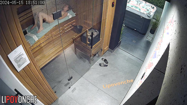Naked woman relaxing naked in the sauna / hidden video