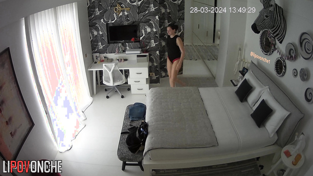 Naked brunette is about to open a letter from her lover