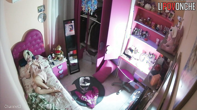 Girl teenager plays in her phone laying in bathrobe and having no lingerie on