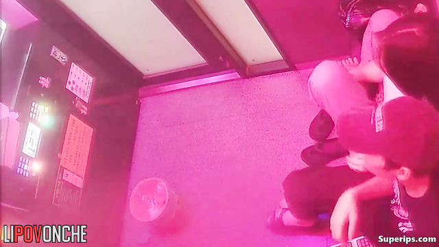Look at moments of Asian couples forgetting about rules in karaoke cafe