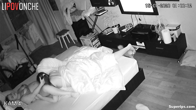 Two older lesbians are pleasuring each other, pausing only to watch TV