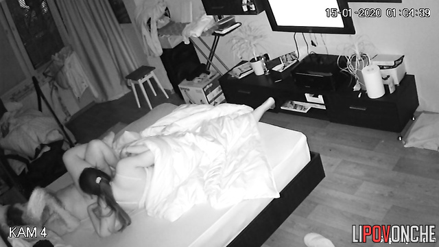 Two older lesbians are pleasuring each other, pausing only to watch TV