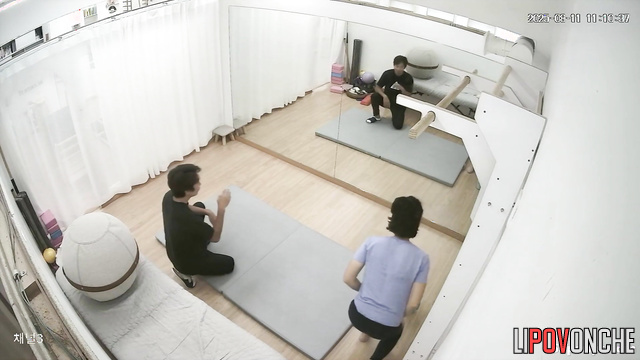 Male physical therapist undresses Asian girl during therapeutic massage