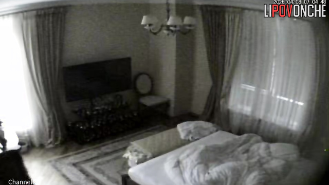 A bald older man gives his naked blonde wife a light massage