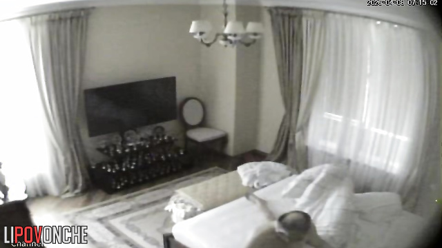 A bald older man gives his naked blonde wife a light massage