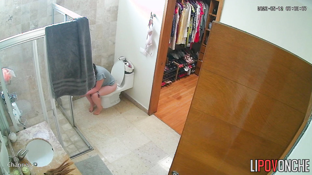 A lazy woman with a sexy ass  wipes her wet, shaved pussy after peeing