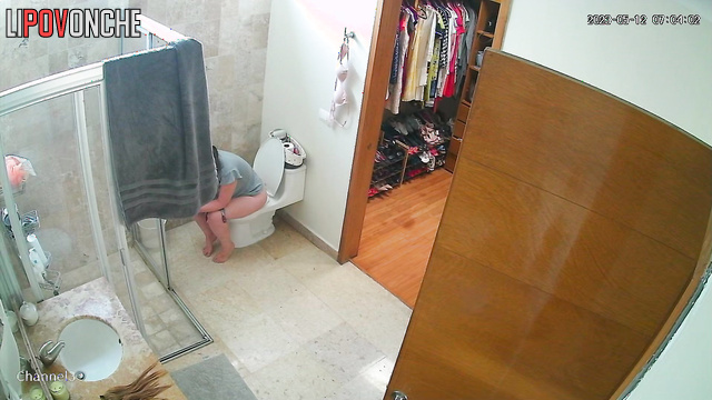 A lazy woman with a sexy ass  wipes her wet, shaved pussy after peeing