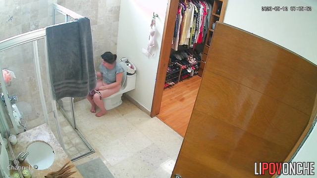 A lazy woman with a sexy ass  wipes her wet, shaved pussy after peeing