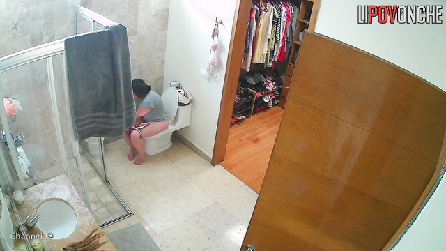 A lazy woman with a sexy ass  wipes her wet, shaved pussy after peeing