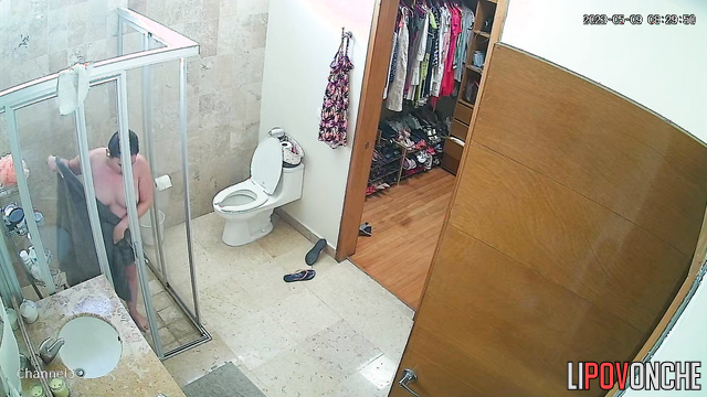 After peeing, a cute naked mommy with a big butt takes a shower