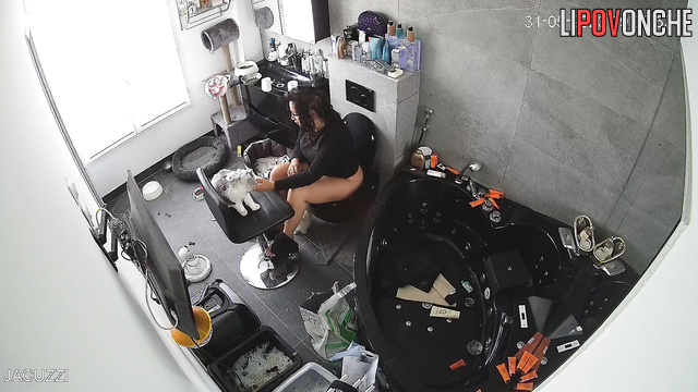 A curly-haired brunette bared her big ass as she sat down on the toilet