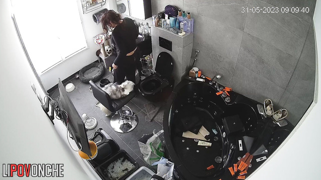 A curly-haired brunette bared her big ass as she sat down on the toilet