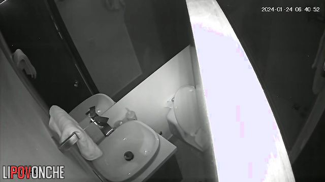 A seductive brunette with a big ass is watching TikTok while sitting on the toilet