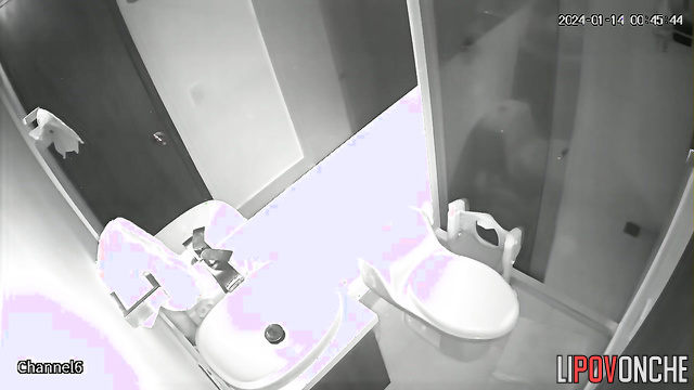 A curly-haired brunette wipes her seductive butt after taking a poop