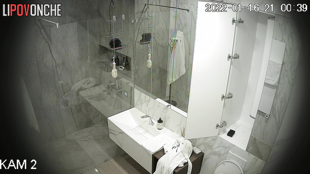 A skinny sporty girl is cleaning the bathroom completely naked