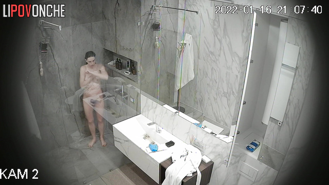 A skinny sporty girl is cleaning the bathroom completely naked