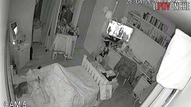 While everyone is asleep, a young girl plays with her tender pussy