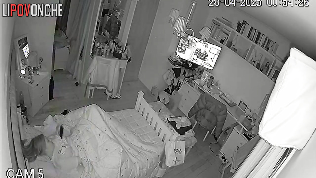 While everyone is asleep, a young girl plays with her tender pussy
