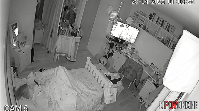 While everyone is asleep, a young girl plays with her tender pussy
