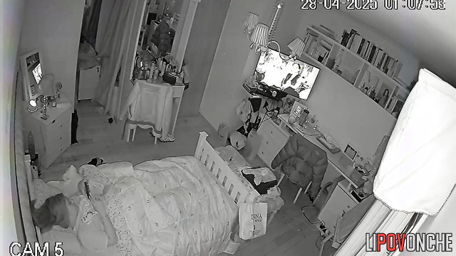 While everyone is asleep, a young girl plays with her tender pussy
