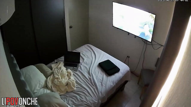 A hidden camera in the bedroom captured the sexy, naked body of a seductive mommy