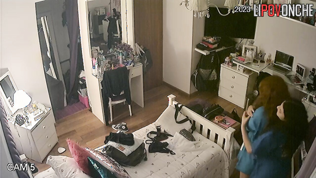 A curly-haired brunette with big tits is pestering on her redheaded friend