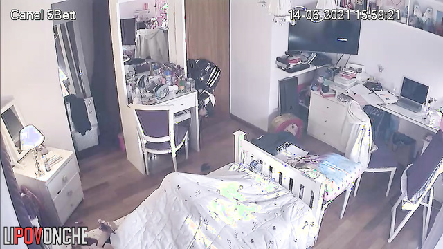 Locked in her room, the girl quietly masturbates under the covers