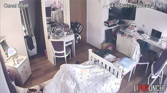 Locked in her room, the girl quietly masturbates under the covers