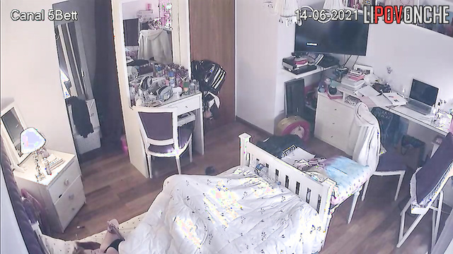 Locked in her room, the girl quietly masturbates under the covers
