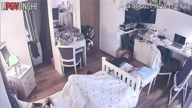 Locked in her room, the girl quietly masturbates under the covers