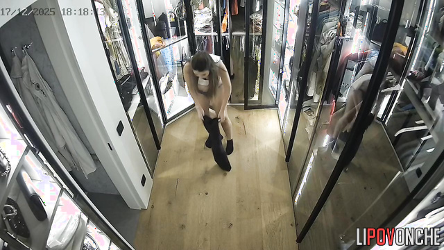 A sexy girl is changing clothes and panties in the dressing room