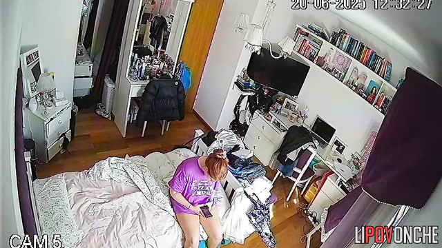 A seductive redhead admires how sexy her bare breasts look in different poses