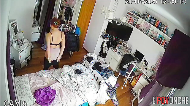A seductive redhead admires how sexy her bare breasts look in different poses