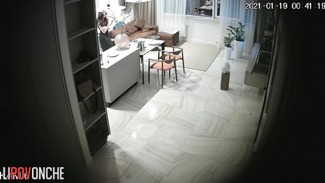 A bald man undresses his pretty wife, caresses her, and drags her into the bedroom