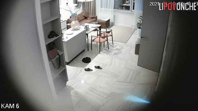 A bald man undresses his pretty wife, caresses her, and drags her into the bedroom