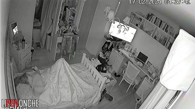 The pretty girl turned up the volume on the TV so no one would hear her moans