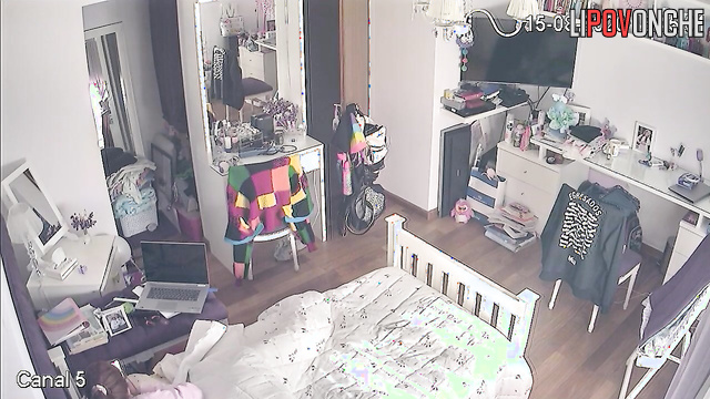 A bored college student was secretly filmed while watching porn in her bed