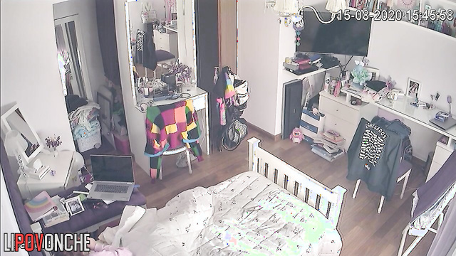 A bored college student was secretly filmed while watching porn in her bed