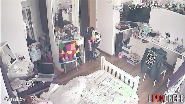 A bored college student was secretly filmed while watching porn in her bed
