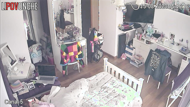 A bored college student was secretly filmed while watching porn in her bed