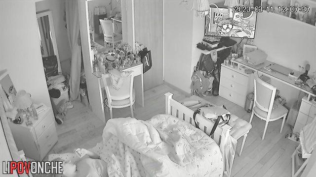 A young teenage girl pulls down her panties under the covers to masturbate