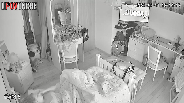 A young teenage girl pulls down her panties under the covers to masturbate