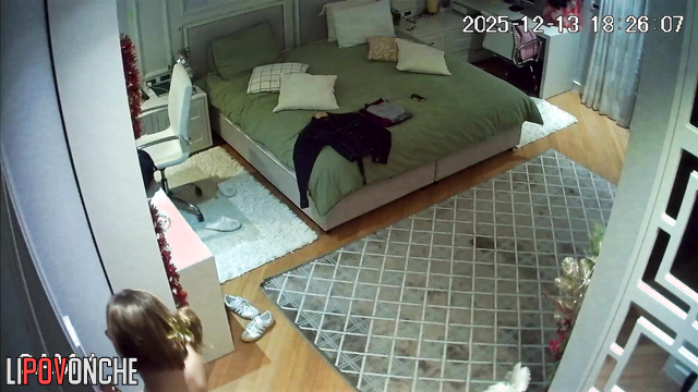 A naked redheaded college student is preparing her uniform for class